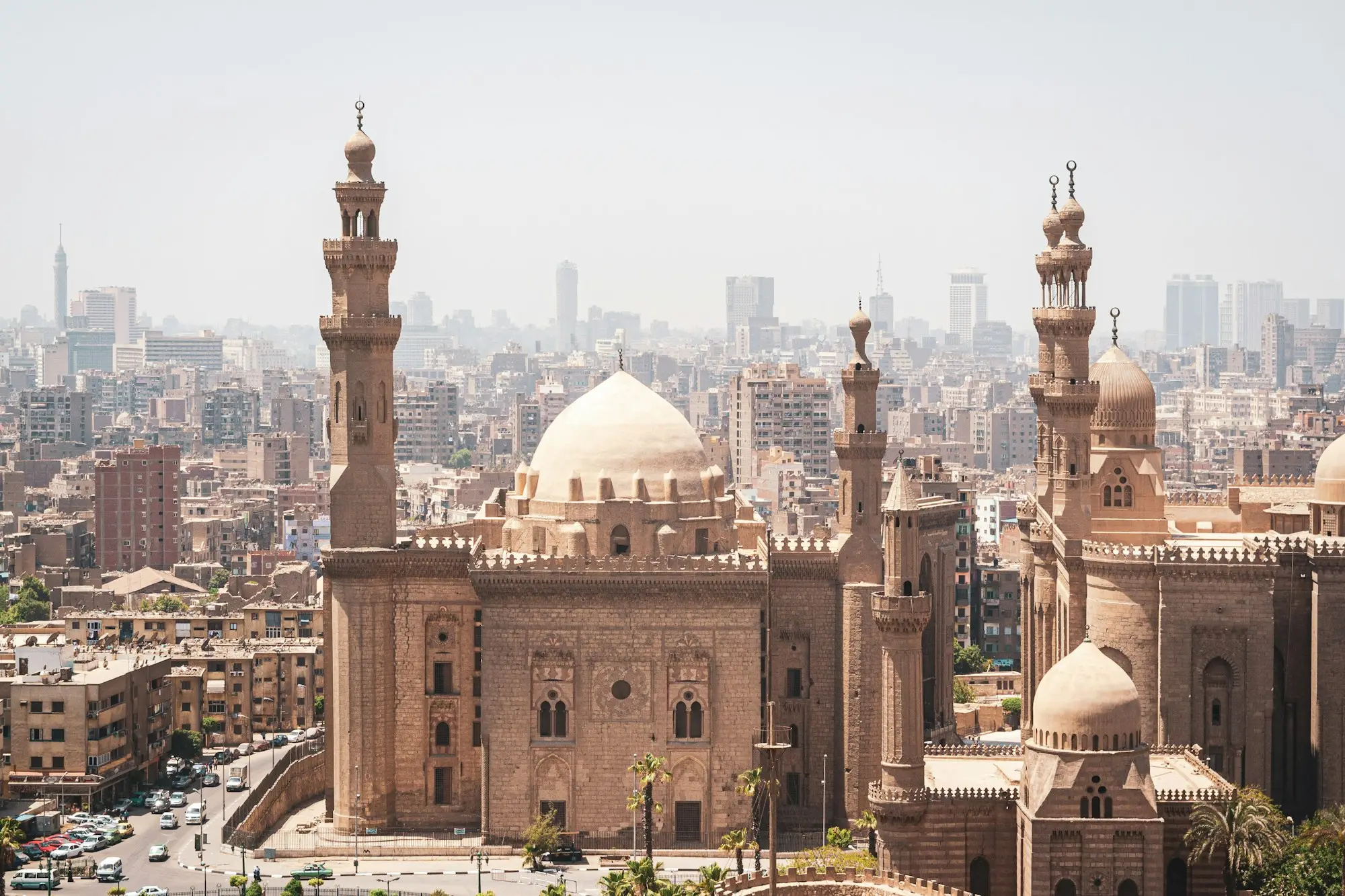 Minarets and domes of the Sultan Hassan and Al-Rifai mosques rising against the Cairo skyline